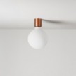 Wandleuchte aus Metall mit Globuslampe in Porzellanoptik